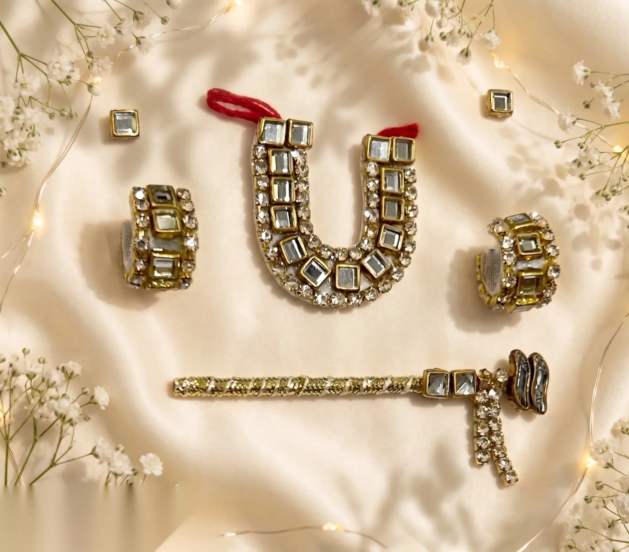 Gold kundan set with U-shaped mirror-work necklace, earrings, bangles, and matching mukut pin.