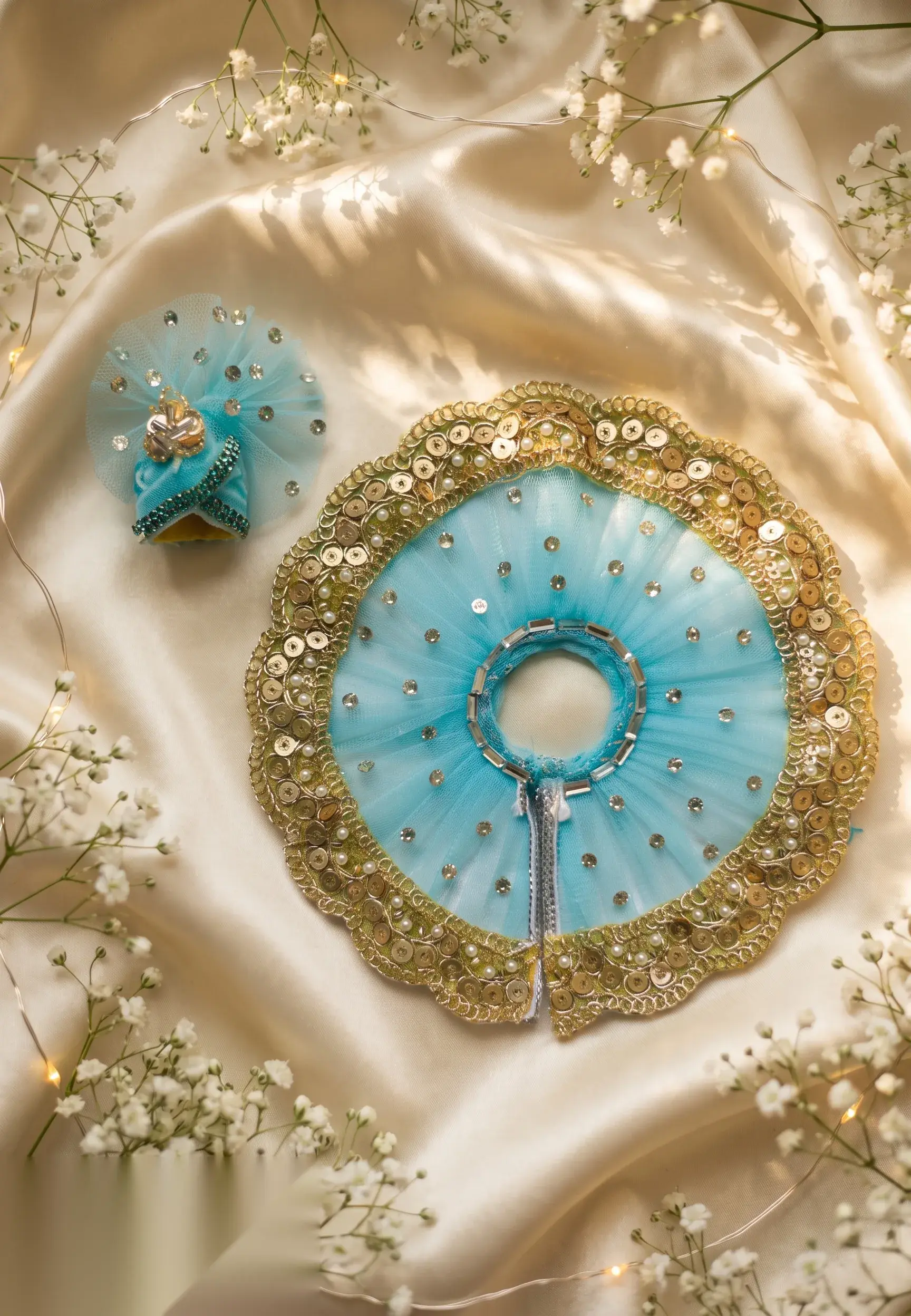 Turquoise and crystal beaded necklace with golden-yellow centre stone, earrings, bangles and mukut pin on display card.